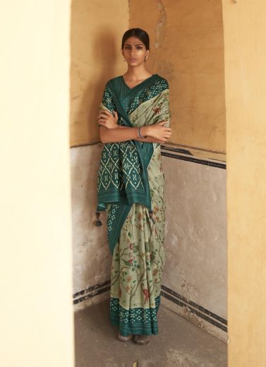 Llight Sage Green Silk Saree With Ikkat Print & Tassels For Parties